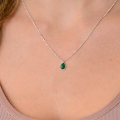 This dainty emerald green teardrop pendant necklace has a delicate silver chain. The chain is solid sterling silver 925., and there is an extension so that the size can be adjusted. There are different stonees to choose from. The stones are natural stones and no 2 are identical, but they are similar. If you would like a custom order or have any questions please contact me, thanks. Silver Necklace Green Stone, Green Sterling Silver Charm Necklace, Green Gemstone Charm Necklace In Sterling Silver, Silver Teardrop Birthstone Charm Necklace, Green Gemstone Sterling Silver Charm Necklace, Sterling Silver Teardrop Charm Necklace With Delicate Chain, Sterling Silver Teardrop Birthstone Charm Necklace, Sterling Silver Teardrop Drop Necklace With Delicate Chain, Silver Emerald Teardrop Necklace