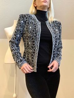 "Dynamite little evening jacket! Black background with white beading in great detail. Fully lined. Shoulder pads. Nipped waist. 19...yes...19!!hook and eye closures up the front!!  Measurements taken flat and are approximate. Please measure carefully as I don't take refunds but feel free to message me with any questions. As with all vintage, there may be irregularities but this jacket is in excellent vintage condition and I can find no issues. These items have had a previous life and that's what's so great about vintage!  The tag reads Large but I find this to be a modern small/medium  Bust: 19\" with hook and eye closure closed Waist: 17\" Length: 22\"" Black Cropped Jacket, Evening Jacket, Beaded Jacket, Evening Jackets, Dress Slacks, Dressy Dresses, Previous Life, 80s Vintage, Vintage Glamour