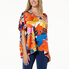 IMAN Global Chic Printed Satin Scarf Top  Take your look from ordinary to extraordinary with this eye-catching printed top that makes the perfect complement to your favorite bottoms. Chic V-neck Top With Bold Print, Patterned Abstract Print V-neck Top, V-neck Beach Top With Abstract Print, Chic Patterned Tops With Abstract Print, Bold Printed Summer Tops, Multicolor Tops With All Over Print For Spring, Bold Printed Tops For Summer, Multicolor V-neck Top With All-over Print, Spring Multicolor Tops With All Over Print