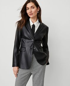 Comfort-chic at its finest, our tailored blazer plays very well with others. Notched lapel. Long button-open sleeves allow for versatility in styling. Two-button front. Front flap besom pockets. Back vent. Lined.,Hit:Hits at hip,Imported:Imported,Fit:Tailored fit,Length:27" long,Fabrication:Imitation Leather Coating: Polyurethann; Back : 100% Polyester;Lining : 100% Polyester,Garment Care:Machine Washable The Greenwich Blazer in Faux Leather by Ann Taylor Size regular - 10 Black Women's Faux, Le Black Leather Blazer Outfit, Leather Blazers, Comfort Chic, Black Leather Blazer, Blazer Outfits For Women, Open Sleeves, Open Sleeve, Black Leather Skirts, Tailored Blazer