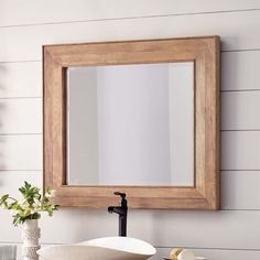 a bathroom sink with a mirror above it