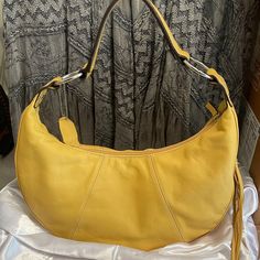 Worthington Genuine Leather Yellow Purse Shoulder Bag Hand Bag Casual Or Dressy. Side Tassell With Zipper Compartment. Inside Zipper Compartment Plus Two Inside Pockets. Yellow Lining. Lightweight. Medium Size. Condition : Fair. Although I've Never Used This Bag I Am Seeing A Few Tiny Flaws. Not Very Noticeable But Just Being Transparent. Price Reflects This. Casual Yellow Satchel Affordable, Elegant Spring Shoulder Bag In Soft Leather, Elegant Soft Leather Shoulder Bag For Spring, Elegant Tan Hobo Bag For Everyday Use, Elegant Tan Hobo Shoulder Bag, Elegant Tan Hobo Bag For Daily Use, Elegant Summer Hobo Bag, Elegant Soft Leather Bag For Spring, Elegant Spring Hobo Bag For Shopping