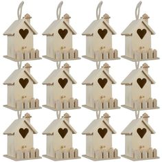 twelve wooden birdhouses with hearts on them