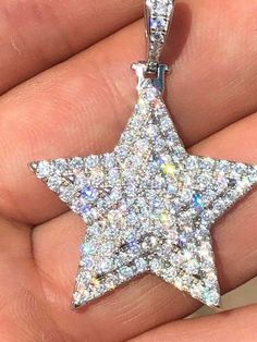 "Custom made super iced out STAR PENDANT. Made from 100% Solid 925 Sterling silver and finished in your choice of either Rhodium or 14k yellow gold. Adorned with 200 micro paved simulated diamonds (CZ) to give this piece an amazing super icy look! Measures approximately 1.25\" x 1.25\" and weighs approximately 8 grams. You can buy pendant only or with choice of 18-30\" 2.5mm diamond cut ball moon chains IF YOU WANT PENDANT ONLY, SELECT \"0\" Chains are also solid sterling silver and come with a Silver Star-shaped Diamond Necklace, Dazzling Star-shaped Cubic Zirconia Jewelry, Silver Diamond Star Necklace, Sparkling Silver Starburst Jewelry, Dazzling Star-shaped Sparkling Jewelry, Dazzling Sparkling Star Jewelry, Sparkling Star-shaped White Gold Jewelry, White Gold Pendant Necklace With Star Charm, Dazzling Silver Star Jewelry