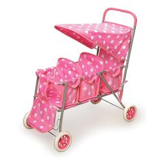 a pink and white toy wagon with polka dots on the side, filled with baby diapers