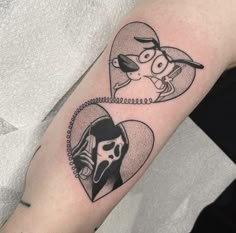 a couple of tattoos that are on someone's left arm and one is holding a phone