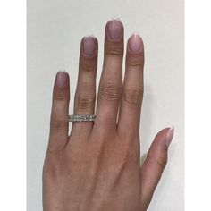 a woman's hand with a ring on it