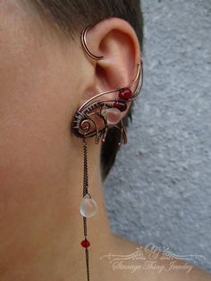 A pair of ear cuffs made of copper wire, chains and glass Czech beads. These ear wraps are worn behing your ear like a Blue Tooth device and no piercing is needed.  They are easy to adjust to the size of ear more perfectly by just slowly pulling down (or squeezing) the lower part of the ear cuff, this pair is adjustable for ear sized 2.1 - 2.7 inches (5.3 - 6.6 cm) . For ear cuff of smaler or bigger size convo me, Ill be happy to make a pair specially for you. the ear cuffs come in a gift box... Unique Adjustable Pierced Ear Climbers, Adjustable Unique Ear Cuff, Adjustable Unique Style Ear Climbers, Unique Adjustable Pierced Ear Cuff, Handmade Adjustable Ear Climbers, Unique Metal Ear Cuff As Gift, Unique Metal Ear Climbers With Ear Wire, Unique Metal Cartilage Earrings For Party, Pierced Metal Ear Cuff With Unique Style