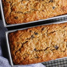 two loafs of oatmeal bread on cooling racks