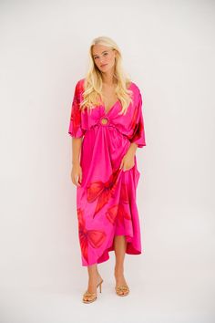 Be the queen of style with our Wrap Queen Pink Dress! Featuring playful red bows, a circle cutout design, and a deep v-neck, this short-sleeved maxi dress is perfect for any occasion. Its loose fitting silhouette adds comfort and flair to your wardrobe. Stand out in this quirky and fun number! All orders are currently shipping within 14 business days. To receive item quicker, expedited shipping is available at checkout. V-neck Midi Dress For Beach Party, Pink Summer Maxi Dress For Holiday, Pink Maxi Dress For Summer Holiday, Beachwear V-neck Midi Dress For Party, V-neck Maxi Dress For Spring Holiday, Red V-neck Beachwear Dress, Pink Party Midi Dress With Surplice Neckline, Pink Midi Party Dress With Surplice Neckline, Pink Midi Dress With Surplice Neckline For Party