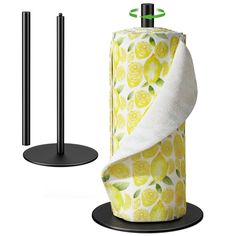 a roll of toilet paper sitting on top of a black stand next to a towel holder