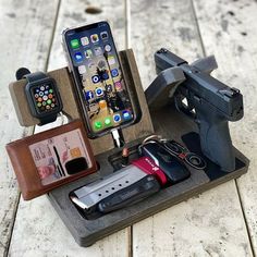 an assortment of cell phones and gadgets on a table