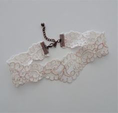 "This lovely choker necklace is made up in a scroll pattern ivory vintage lace. The lace has a 2 tone effect with the edging on the pattern being a blush peach. The choker closes at 13\" on the first link and there is an extension chain for adjustable sizing. The width of the lace is 1 1/2\"\" at widest points. The overall length of the choker including the chain extension is 15 1/2\". The chain extension has a dangle antique copper bead accent. There is an antique copper lobster claw closure fo Lace Choker Necklace, Lace Choker, Scroll Pattern, Necklace Choker, Necklace Vintage, Vintage Lace, Wedding Necklace, Antique Copper, Vintage Necklace