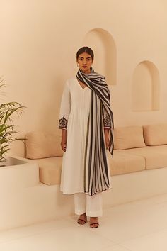 PRODUCT DETAIL: This stunning suit set features exquisite embroidery on the organza sleeves, adding a touch of elegance and sophistication to its tonal design. The shirt boasts intricate pleat detailing on the front, creating a smart and flowy look that is both flattering and comfortable. To complete the ensemble, the Formal Cotton Dupatta, Elegant Sets With Sheer Dupatta And Long Sleeves, Elegant Cotton Sets For Designer Wear, Elegant Unstitched Kurta With Embroidered Sleeves, Elegant Silk Kurta With Embroidered Sleeves, Elegant Cotton Dupatta For Eid, Elegant Cotton Kurta For Formal Occasions, Formal Cotton Dupatta With Resham Embroidery, Elegant Cotton Silk Kurta For Formal Occasions