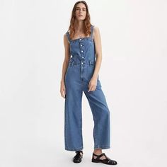 Drea Jumpsuit - Medium Wash | Levi's® US Trendy Bib Front Overalls With Adjustable Straps, Trendy Overalls With Adjustable Straps And Bib Front, Denim Overall Jumpsuit With Buttons For Summer, Summer Denim Overalls Jumpsuit With Buttons, Summer Denim Overalls With Buttons, Trendy Fitted Jumpsuits And Rompers With Adjustable Straps, Levi's Denim Jumpsuit With Pockets For Summer, Trendy Sleeveless Jumpsuits And Rompers With Button Closure, Trendy Sleeveless Jumpsuit With Button Closure