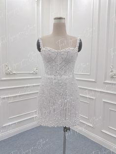 a white dress on display in a room