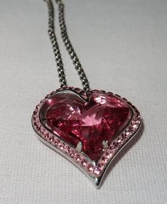 Romantic vintage marked sterling au Pink Heart necklace with an 18 inch chain .  stones are glass.  heart measures is 13/16 wide and 3/4 inch long. Valentine's Day Heart-shaped Jewel Necklaces, Valentine's Day Heart Necklace With Jewels, Valentine's Day Heart Shaped Jewel Necklace, Vintage Pink Necklace For Valentine's Day, Vintage Pink Necklaces For Valentine's Day, Silver Jeweled Necklaces For Valentine's Day, Valentine's Day Silver Jeweled Necklaces, Vintage Pink Heart Necklaces, Valentine's Day Jeweled Pendant Necklace