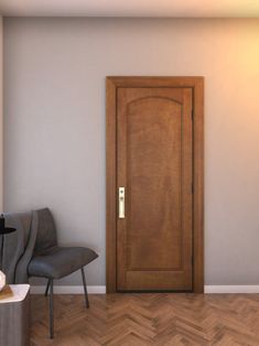 an empty room with a chair and a wooden door