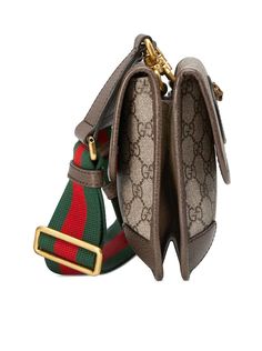 Oval Gucci leather tag with metal feline head. Green and red strap. Flap pocket on the front. Made in Italy Composition: Polyurethane 60% polyurethane 20% cotton 20% polyester 21X16X4 CM STRAP: 50.5 CM Color code: 8745 BEIGE EBONY NEW ACERO Size Type: STANDARDSKU: 5010509C2VT Our Products Are 100% Genuine. In All Cases We Stand By The Authenticity Of Every Product Sold On Our Site. Rhombus Design, Brass Accessories, Small Messenger Bag, Italy Print, Leather Tag, Gucci Fashion, Gucci Leather, Digital Gifts, Green And Red