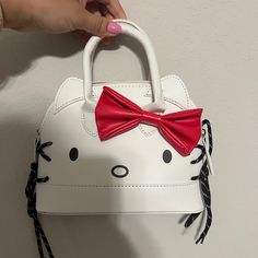 Nwot Cute Hello Kitty Satchel Crossbody Purse. Comes With Long Strap. Approx Largest Measurements: At Base: Wide 8.5”X Depth3.5”. Tall 6.5” Approx 3” Handle Drop. Comes With Longer Removable Crossbody Strap Vegan Leather White With Red Bow. Cool String Decorative Sides Trendy White Hello Kitty Bag, Trendy White Bag With Cat Design, White Hello Kitty Print Bag, Playful White Bags With Hello Kitty Print, White Playful Hello Kitty Print Bags, Playful White Hello Kitty Print Bag, Cool Bags, Hello Kitty Bags, Kitty Items