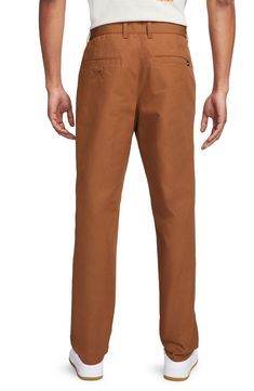 Classic and comfortable, these versatile cotton chinos feature a relaxed, straight-leg fit that makes them an ideal go-to for any occasion. 32" inseam; 16 1/2" leg opening; 13" front rise; 16" back rise (size 32) Zip fly with button closure Front slant pockets; back welt and button-welt pockets 100% cotton Machine wash, tumble dry Imported Nike Cotton Bottoms With Relaxed Fit, Nike Cotton Bottoms In Solid Color, Nike Cotton Bottoms, Brown Casual Chinos For Business Casual, Nike Cotton Pants For Spring, Nike Straight Leg Bottoms With Relaxed Fit, Casual Flat Front Chinos With Welt Pockets, Casual Nike Pants With Straight Hem, Nike Casual Pants With Straight Hem