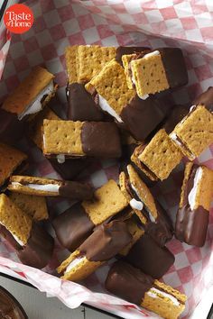 a basket filled with marshmallows and graham crackers on top of a table