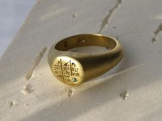 The Seti ring is engraved with intricate hieroglyphs of ancient Egyptian mysteries and set with a 1.6mm natural emerald to symbolise renewal and vitality. Named after Pharaoh Seti I, a powerful ruler of the 19th Dynasty known for his military prowess and monumental constructions, including the grand temple at Abydos. Seti's reign marked a period of revival in Egypt's fortunes, and this ring captures his legacy of strength and prosperity. A timeless piece, the Seti Ring blends ancient history wit Ceremonial Yellow Gold Emerald Heirloom Ring, Ceremonial Heirloom Yellow Gold Emerald Ring, Heirloom Yellow Gold Engraved Emerald Ring, Heirloom Engraved Emerald Ring In Yellow Gold, Traditional Gold Emerald Anniversary Ring, Spiritual Yellow Gold Signet Ring, Spiritual Yellow Gold Engraved Promise Ring, Heirloom Gold Engraved Emerald Ring, Spiritual Engraved Yellow Gold Promise Ring