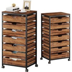 two wooden drawers sitting next to each other on casteors with wheels and baskets in them