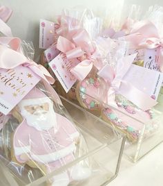 some cookies are wrapped in plastic and have pink bows