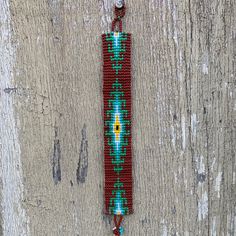 Beaded Wristband Bracelet, Handcrafted, Casual Bracelets, Loom, Jewelry, Multicolored Seed Beads, Teal and Brown, Western Look, 1 x 7 inch Sparkly seed beads where used to create this beautiful beaded bracelet. *Casual Wear Beaded Bracelet *Native American Inspired Design *The bracelet can be secured at one of three lengths with a beaded button. *Handmade in Guatemala Green Beaded Bracelets With Colorful Beads For Crafting, Southwestern Green Beaded Bracelets For Festival, Southwestern Style Green Beaded Bracelets For Festival, Southwestern Style Green Bracelets For Festivals, Southwestern Adjustable Bracelet With Large Beads, Brown Beaded Round Bead Friendship Bracelets, Brown Beaded Friendship Bracelets With Round Beads, Spiritual Brown Beaded Friendship Bracelets, Adjustable Southwestern Beaded Bracelet With Large Beads