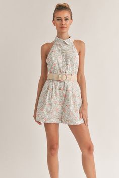 Embrace the bloomy side of life with our Floral Print Romper with Belt. This versatile design is your ticket to a stylish and comfortable look this summer. With a stunning floral print that exudes freshness, a flattering halter neckline, and a belt to cinch around the waist, this romper is a must-have in your wardrobe. Stay organized and stylish with convenient pockets to store your essentials while you take on your next adventure. Unleash your wild side and live life to the fullest in this chic Feminine Halter Neck Top For Vacation, Chic Floral Print Halter Top For Day Out, Chic Floral Print Halter Top, Summer Floral Print Halter Top For Day Out, Spring Floral Print Halter Top For Beach, Sleeveless Floral Print Halter Top For Spring, Feminine Spring Vacation Halter Top, Feminine Summer Halter Top For Day Out, Feminine Halter Top For Spring Vacation