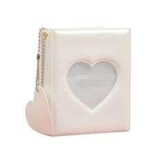 a white box with a heart on the front and chain at the bottom that is attached to it