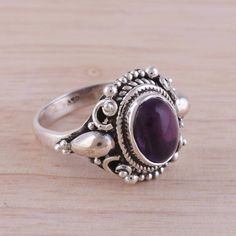 A deep purple amethyst rests in a bezel of sterling silver in this cocktail ring. Designed by Alok Jain of India, the ring is handcrafted with dot and rope motifs that give the accessory an exotic flavor. Purple Amethyst Cabochon Ring Fine Jewelry, Fine Jewelry Purple Amethyst Cabochon Ring, Classic Purple Cabochon Jewelry, Cabochon Amethyst Ring Fine Jewelry, Classic Purple Cabochon Rings, Cabochon Amethyst Ring In Fine Jewelry Style, Classic Cabochon Amethyst Ring, Classic Amethyst Cabochon Ring, Classic Purple Sterling Silver Ring