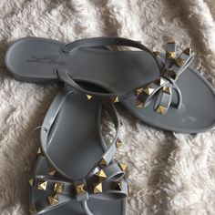 Beautiful Jelly Sandal. Gold Studded Bow. If You Wear Half Size Please Order Next Size Up. Soft Flexible Pvc Material. Imported Gray Sandals For Summer Vacation, Gray Flat Sandals For The Beach, Gray Flip Flops For Beach And Summer, Gray Flip Flops For Beach In Summer, Adjustable Gray Sandals For Summer, Birkenstock Madrid Big Buckle, Dad Sandals, Jelly Flip Flops, Dolce Vita Sandals