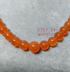 jewelry: jade necklace colour: orange Diameter: 6-12mm shape: round Necklace length: select Clasp: stainless steel lobster Clasp Packing: Beautiful Pouch Click on the image(s) for larger view If you want to order of different style. Please feel free contact me . Thank you for your viewing. The other turquoise necklaces: https://www.etsy.com/shop/weddingpearl/search?search_query=turquoise+necklaces&order=date_desc&view_type=list&ref=shop_search Turquoise Necklaces, Pearl Bracelet Wedding, Necklace Orange, White Pearl Bracelet, Color Necklace, Round Necklace, Wedding Party Jewelry, Freshwater Pearl Bracelet, Jade Necklace