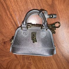 Brand New Without Tags Samantha Thavasa Silver Mini Handbag Charm Chain With Clip Functional Zipper Top Rhinestone And Charm Detail Some Discoloration On The Interior (From Storage, Item Is New) Received As A Vip Customer Silver Bags With Chain Strap For Daily Use, Silver Bag With Chain Strap For Daily Use, Silver Bags With Metal Hardware, Luxury Silver Shoulder Bag For Daily Use, Silver Bag With Chain Strap For Gift, Silver Rectangular Shoulder Bag With Metal Hardware, Silver Formal Bag With Chain Strap, Silver Shoulder Bag With Chain Strap For Gift, Silver Shoulder Bag With Chain Strap As Gift