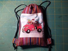 a drawstring bag with a red firetruck on it