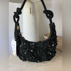 New Drop!!! Viral Black Beaded Bag With Detailed Knot Tie Straps And Tassel Zipper. Perfect Style For Year Round Fashion And Versatile With Dress Up Occasions Or Casual Too! Weddings, Parties, New Year’s, Casual Dinners, Vacations! Don’t Pass This Unique Style! In Perfect Condition, No Flaws! New With Tags, Smoke Free Home Luxury Black Beaded Evening Bag, Embellished Black Evening Shoulder Bag, Black Embellished Evening Bag, Chic Black Embellished Shoulder Bag, Black Beaded Bag For Night Out, Chic Black Embellished Bags, Chic Beaded Bags For Night Out, Black Embellished Bags As Fashion Accessory, Chic Black Beaded Shoulder Bag