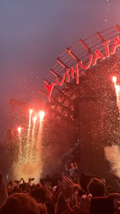 the stage is lit up with red and white fireworks