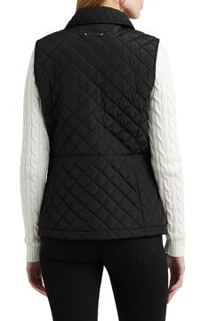 Puffed diamond-shaped quilting brings warmth to this outdoorsy vest designed with a chest logo patch. 25" length Front snap closure Spread collar Side zip pockets 100% recycled polyester Machine wash, tumble dry Imported Black Quilted Nylon Vest, Quilted Black Nylon Vest, Sleeveless Quilted Black Outerwear, Black Quilted Sleeveless Vest, Black Quilted Outdoor Vest, Black Quilted Vest For Cold Weather, Sleeveless Quilted Vest For Outdoor Activities, Ralph Lauren Vest, Olive Tan