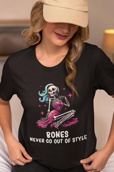 This "BONES NEVER GO OUT OF STYLE" Skeleton design is the perfect Shirt/Gift for all fashion lovers on Halloween! All of our shirts are super soft and cozy! Ø Bella and Canvas Brand Shirts Ø Unisex Adult Sizing Ø Props used in photos or videos are NOT included with purchase WASHING INSTRUCTIONS Ø Wash inside out, in cold water, on gentle cycle. Tumble dry low or let air dry Ø Do not use Fabric Softeners or Bleach Ø Do not dry clean. Avoid ironing on the design. Inside out ironing will make the design last longer  SIZE Ø Please take a look at the photos for a specific sizing chart for this t-shirt style Ø Lay your shirt at home flat and measure armpit to armpit to compare to the size chart in the photos  RETURNS OR EXCHANGES Ø Unfortunately, since all of our shirts are custom printed just f Cheap Spooky Tops With Funny Print, Skeleton Design, Funny Pun, Brand Shirts, Halloween Skeleton, Halloween Theme, Graphic Design Print, Halloween Tees, Branded Shirts