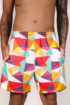 Introducing the Prism Shorts - designed to make a statement wherever you go. Crafted with exclusive patterns and a luxurious sublimated logo on the back pocket, these shorts boast two practical zipper pockets in the front - a beautiful and functional touch. A perfect pick for beach days, a classic fete, or the road. Small 30-32 | Medium 32-34 | Large 34-36. The model is a size small and is wearing a size small. We offer world wide international shipping as well as local Trinidad & Tobago shippin White Beach Shorts With Side Pockets, White Shorts With Side Pockets For Beach, Multicolor Sports Shorts With Pockets, Summer Shorts With Side Pockets For Poolside, Summer Bermuda Shorts In Multicolor, White Printed Beachwear Shorts, Multicolor Short Athletic Shorts For Beach Season, Multicolor Swim Trunks With Pockets, Multicolor Athletic Shorts For Beach Season