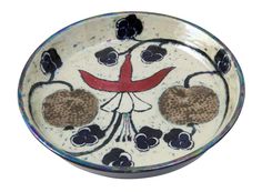 a bowl with flowers and hearts painted on it