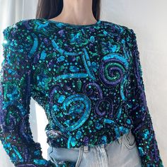 Details Blue/Green And Purple Sequin Long Sleeve Blouse Shoulder Pads Multi-Color Sequin Back Zipper With Hook And Eye Lined Bodice V Front And Back Hem 100% Silk Condition: Item Is Deadstock (With Tags) Vintage So It Is Mint Condition Decade: 1980's Brand: Laurence Kazar Sizing Size: Xl But Fits More Like A Large Measurements Pit To Pit: 19 ½” Waist: 16 ½” Length From Hps: 21 ½” Bicep: 6 ¾” Sleeve Opening: 4 3/4 X Excellent Vintage Condition. Item Has Been Cleaned And Is Ready To Wear. Xx Comes Blue Sequin Top For Fall, Blue Sequined Tops For Fall, Blue Embellished Top For Evening, Blue Long Sleeve Sequin Top, Blue Embellished Tops For Fall, Blue Embellished Long Sleeve Top, Vintage Multicolor Tops For Party, Magenta Top, Black Crochet Top