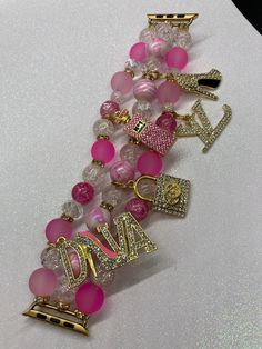 Handcrafted Custom Apple Watch band with glass beads, rhinestones and charms!  38/40/41mm or 42/44/45/49mm. PLEASE CHOOSE A SIZE WHEN PLACING YOUR ORDER. Charms may vary. Women Apple Watch, Custom Apple Watch Bands, Girly Bracelets, Beaded Watches, Pink Passion, Luxe Jewelry, Jewelry Accessories Ideas, Custom Charms, Pink Girly Things