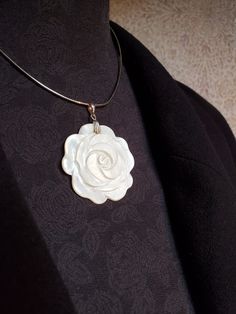 This is a lovely piece.  Simple, yet stunning and sophisticated.  Perfect for your 'Big Day'  The delicate flower motif made from Mother of Pearl has a rich cream colour.  I have hung it simply on a 12" Sterling Silver Choker.  I have added a 3" extension chain for your comfort.  Minimalist yet striking!  Just perfect.  The pendant is 5cms overall the flower motif is 4cms round.  Pearl for a 30th Wedding Anniversary too! Elegant Flower Decorated Jewelry For Anniversary, Elegant Flower Decoration Jewelry For Anniversary, Elegant Anniversary Jewelry With Flower Decoration, Elegant Petal-shaped Jewelry With Flower Decoration, Elegant Flower Shaped Necklace For Weddings, Elegant Jewelry For Special Day, White Rose Design Necklace For Wedding, Elegant Flower Shaped Wedding Necklace, Formal White Flower Necklaces