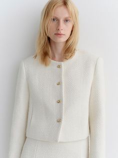 This is a modern and feminine tweed jacket by ARCHAIC that is made out of high quality and sturdy material. With distinctive mood of the design and comfortable wear, you can style it for your modern daily outfit.- Clean and minimal silhouette- Classic gold color buttons on the front- Set up with matching skirt Elegant Tweed Jacket With Button Cuffs, Chic White Tweed Jacket With Button Closure, Elegant Tweed Outerwear With Button Cuffs, White Wool Tweed Jacket In Chic Style, Chic White Wool Tweed Jacket, Chic Wool Tweed Jacket With Buttons, Chic Tweed Blazer With Button Cuffs, Clean And Minimal, Chanel Jacket