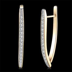 Add sophisticated finesse to your accessory collection with these drop earrings boasting cubic zirconia accents and 18-karat gold plating. 0.12 in W x?1.46?in H 18k gold-plated?copper / cubic zirconia Clip-on Weight:?5.2 g Diamond Earrings For Women, Crystal Earrings Wedding, Color Earrings, Jewelry Beautiful, Halo Earrings Studs, Woman Fashion, Champagne Gold, Geometric Earrings, Diamond Crystal