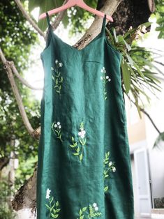 ❤ The hand embroidered linen dress is very soft, skin friendly, breezy and comfortable.  ❤ Item description: - A lovely dress with embroidered flowers motifs. - Suitable for hot summer. - Material: linen, button, embroidery threads. - Environmentally friendly. - This dress is very useful, go with any outfit, that can be used to go out, go shopping...    It is a perfect gift for yourself or your beloved.  ❤ Care instructions:      The best way to wash embroidery cloth is to put it in soapy water (with a mild detergent and cold water at 86 ºF/30oС) for 20 minutes. Try to not wash the item with other clothing that might cause damage, such as zippers, buttons or different colors. You wash it by hand, and if you have dirty patches on your garment, you can gently rub them, it's best not to rub d Dress Hand Embroidery, Flowers Motifs, Dress With Embroidered Flowers, Embroidered Linen Dress, Button Embroidery, Linen Slip Dress, Hand Embroidery Dress, Diy Embroidery Patterns, Embroidery Threads