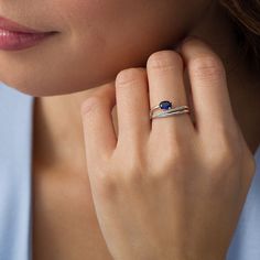 A unique display of your growing love, this modern promise ring is an eye-catching choice she won’t be able to resist. Crafted in sterling silver, this smart style features a 5.0 x 3.0mm oval-shaped lab-created bright blue sapphire punctuating the outer ribbon of the split multi-row shank. The centre ribbon sparkles with diamonds while a polished ribbon completes the look. Captivating with 0.04 ct. t.w. of diamonds and a brilliant buffed lustre, this design elevates her attire. Custom-made to fit her ring size. Sterling silver rings cannot be resized after purchase. Her Ring, Peoples Jewellers, Unique Display, Sapphire Stone, Diamond Stone, Diamond Clarity, White Metal, Promise Ring, Blue Stone